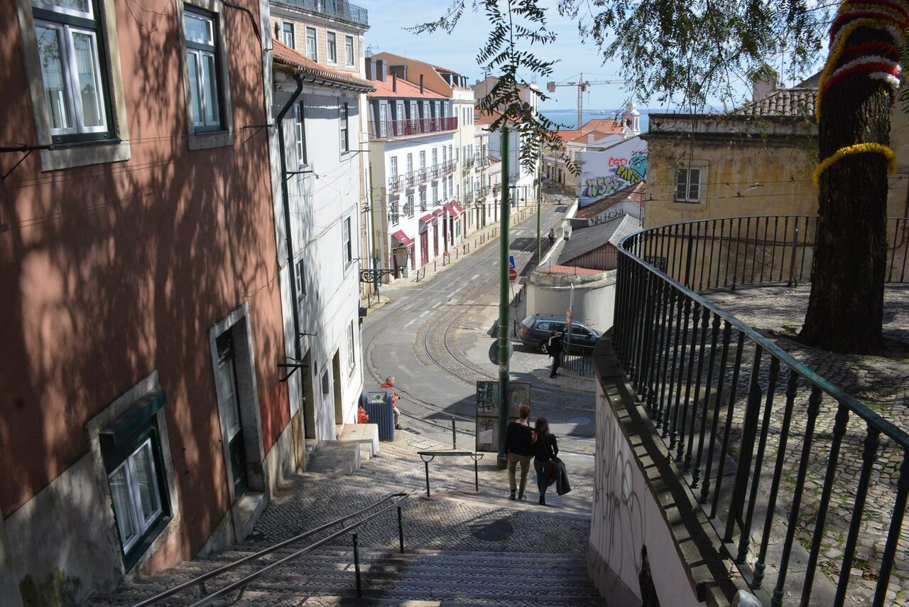 Stone steps and tiled buildings in Alfama, Lisbon.